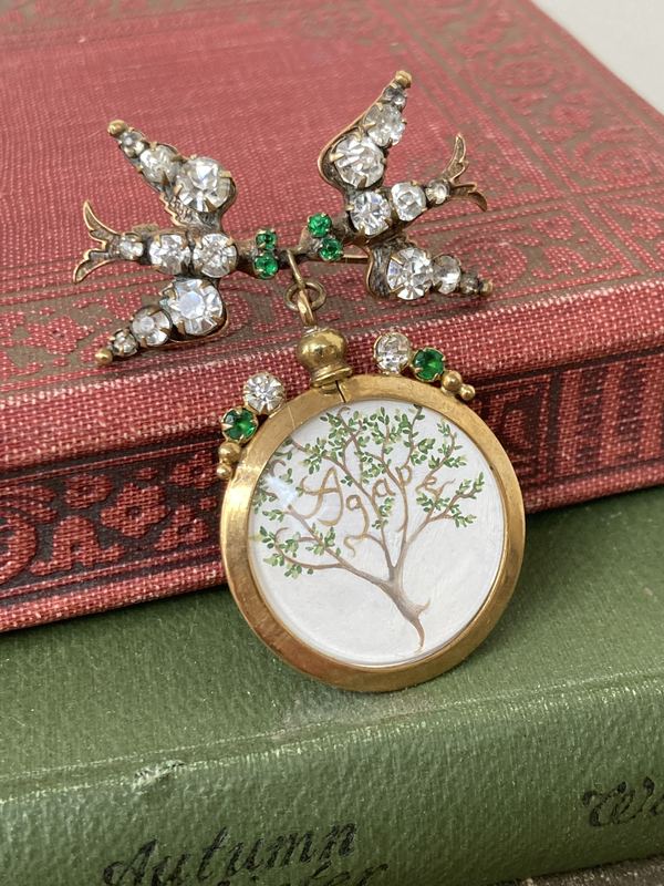 Agape. A tree hung from an antique bird brooch