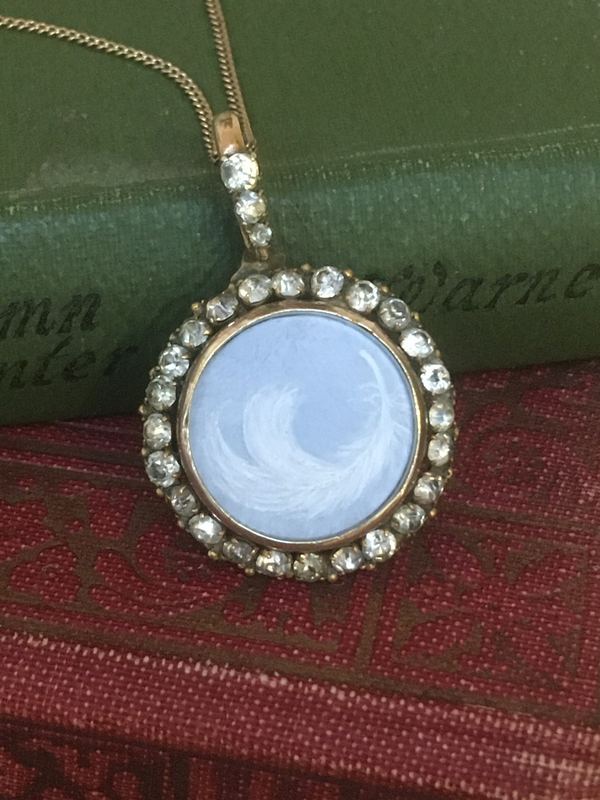 Angel feather. In a paste-set pendant