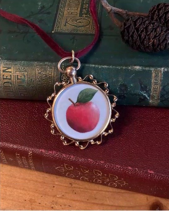 Apple. In an antique Edwardian locket