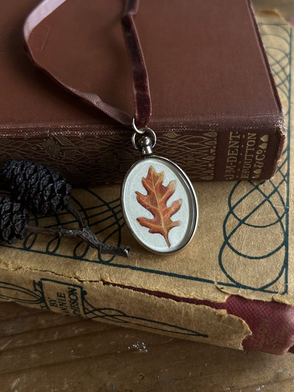 Autumn oak leaf. In a small oval locket