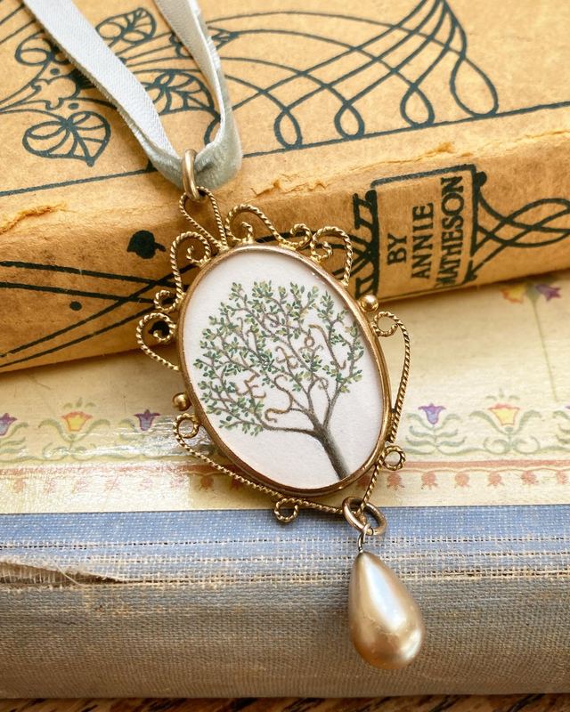 Estel. A Tolkien pendant with a pearl drop. Estel is Elvish for hope.