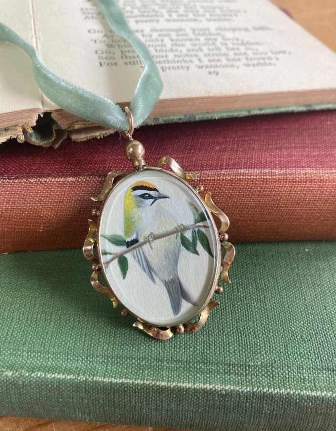 Firecrest. Britain’s smallest bird, in an antique glass locket