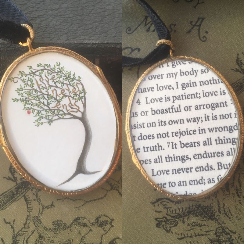 A double locket: a tree on one side, Corinthians on the other